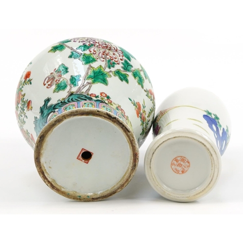 555A - Two Chinese porcelain vases including a baluster lidded example hand painted in the famille rose pal... 