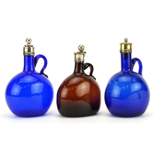 204 - Three antique coloured glass whisky decanters with silver plated mounts including two Bristol blue e... 