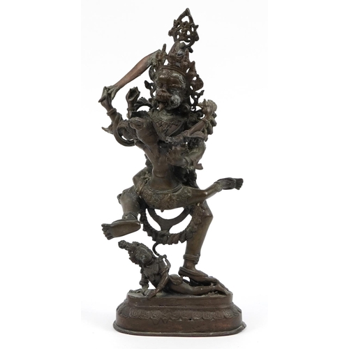 196 - Indian patinated bronze figure group of three deities, 48cm high