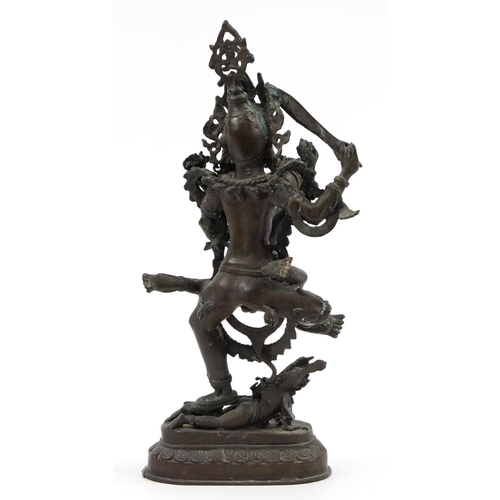 196 - Indian patinated bronze figure group of three deities, 48cm high