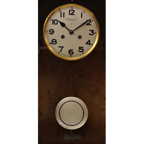 259 - German Art Deco walnut wall clock with circular silvered dial having Arabic numerals, inscribed H Sc... 