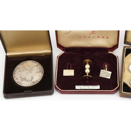 2460 - Coins, medallions, cufflinks and studs including United States of America 1991 one ounce silver doll... 