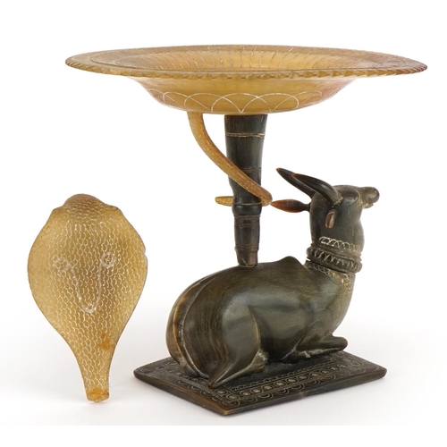 293 - Indian horn pedestal dish carved with a water buffalo and cobra, signed to the base, overall 19cm hi... 