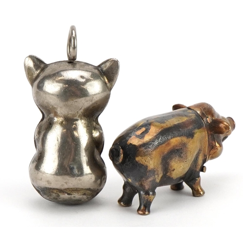 1285 - Novelty brass vesta case in the form of a pig and a silver plated baby's rattle in the form of a cat... 