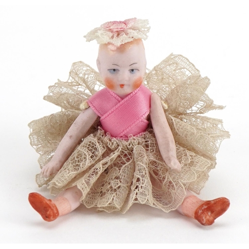 2013 - Miniature continental bisque porcelain doll with lace skirt, 7.5cm high