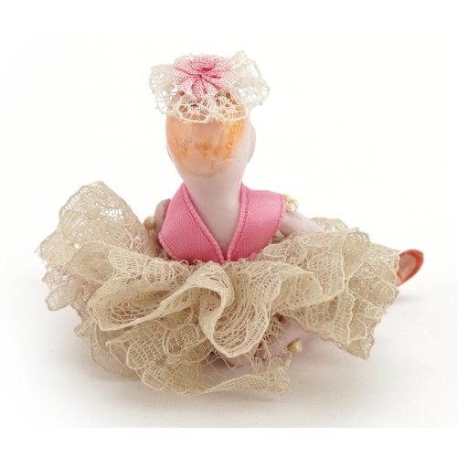 2013 - Miniature continental bisque porcelain doll with lace skirt, 7.5cm high