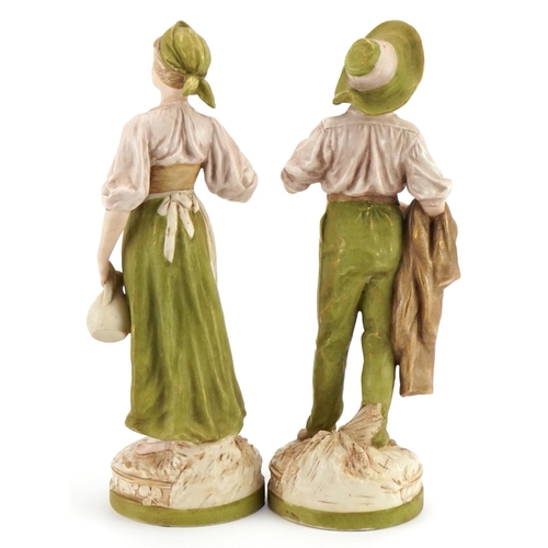 248 - Royal Dux, pair of Art Nouveau Czechoslovakian figures of peasants numbered 1455 and 1456, the large... 
