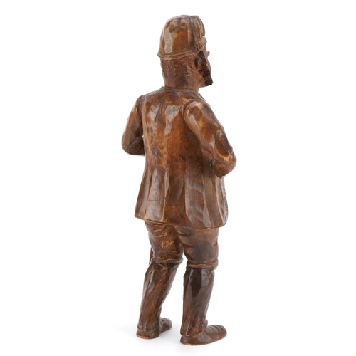 397 - 19th century Bavarian carved wood figure of a bearded man holding a staff, 29cm high