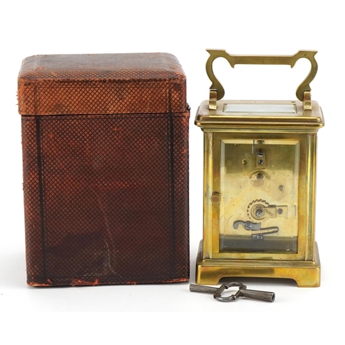 113 - Brass cased carriage clock with fitted travel case, the enamelled dial having Roman numerals, inscri... 