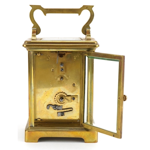 113 - Brass cased carriage clock with fitted travel case, the enamelled dial having Roman numerals, inscri... 