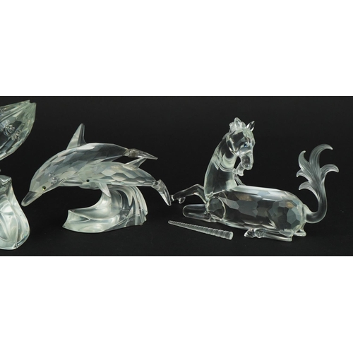 1146 - Four Swarovski Crystal animals comprising unicorn, rearing horse, dolphin with calf and whale with c... 