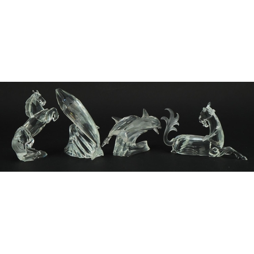 1146 - Four Swarovski Crystal animals comprising unicorn, rearing horse, dolphin with calf and whale with c... 