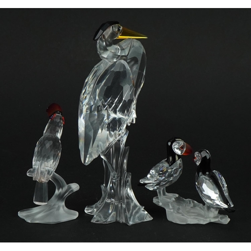 1143 - Three Swarovski Crystal birds comprising heron, pair of puffins and toucan, the largest 15cm high