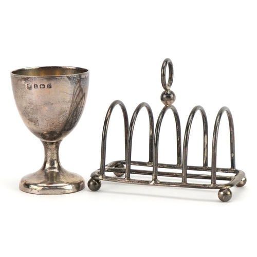188 - Silver four slice toast rack and silver egg cup, the largest 8cm in length, total 108.5g