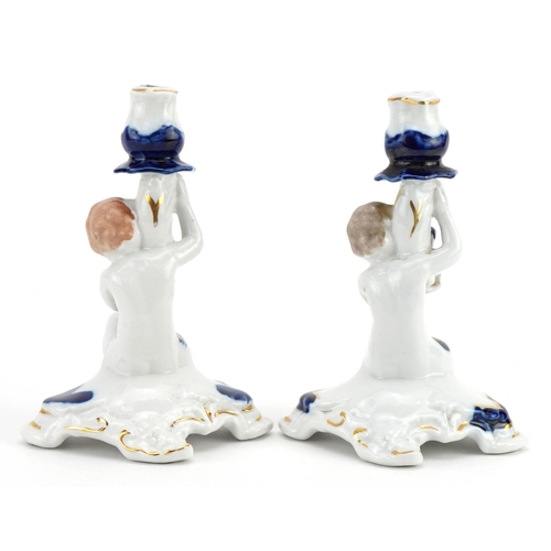 530 - Cestar Lucru Manual, pair of Romanian porcelain figural candlesticks, each 15.5cm high