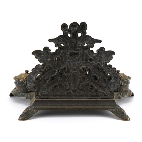 1283 - 19th century style brass desk stand decorated with Putti with letter rack and pair of inkwells, 30cm... 