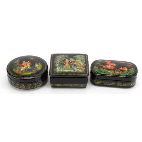 401 - Three Russian lacquered boxes with boxes, each hand painted with figures, the largest 8.5cm wide