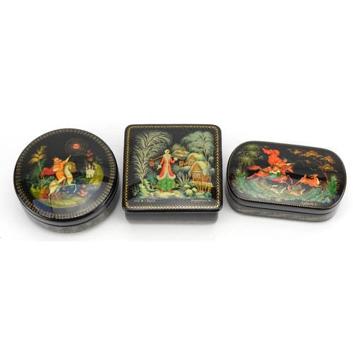 401 - Three Russian lacquered boxes with boxes, each hand painted with figures, the largest 8.5cm wide