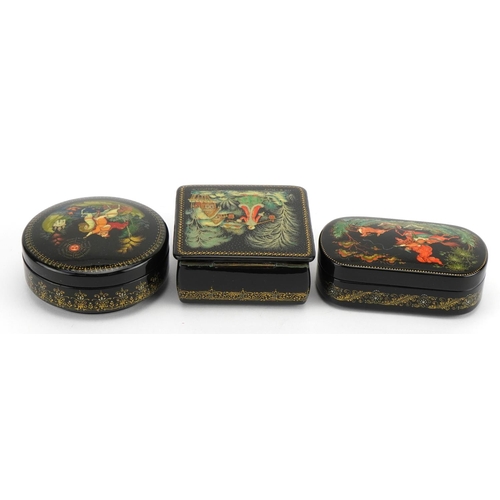 401 - Three Russian lacquered boxes with boxes, each hand painted with figures, the largest 8.5cm wide