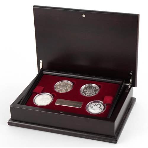 2468 - Footballing interest silver four coin collection housed in a wooden case honouring the FIFA Centenni... 