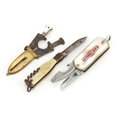 1253 - Objects comprising a cigar cutter in the form of a dagger with sheath, mother of pearl flanked corks... 