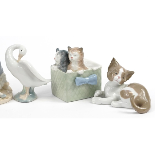 1216 - Lladro and Nao collectable figures and animals including kittens playing, the largest 19.5cm high