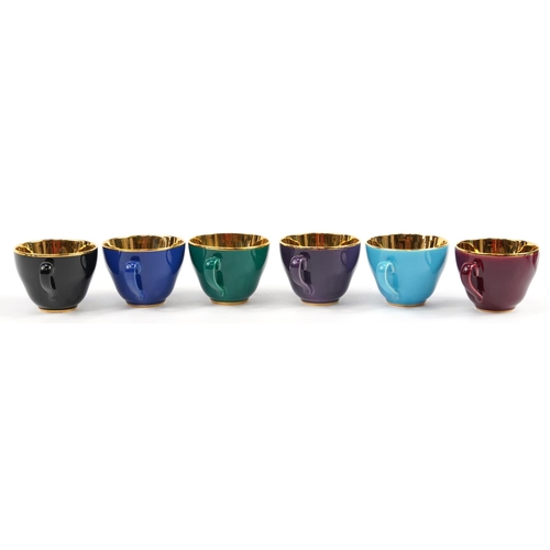 493 - Confetti, set of six Danish colourful cups with saucers having gilt interiors, the cups each 5.5cm h... 