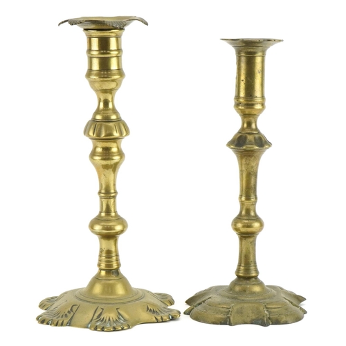 467 - Two 18th century brass candlesticks, the largest 25cm high