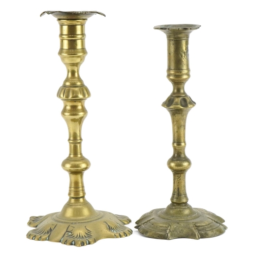 467 - Two 18th century brass candlesticks, the largest 25cm high