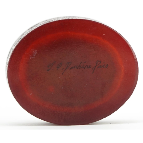 226 - French cherry amber coloured pressed snuff box with lift off lid, decorated in relief with a female,... 