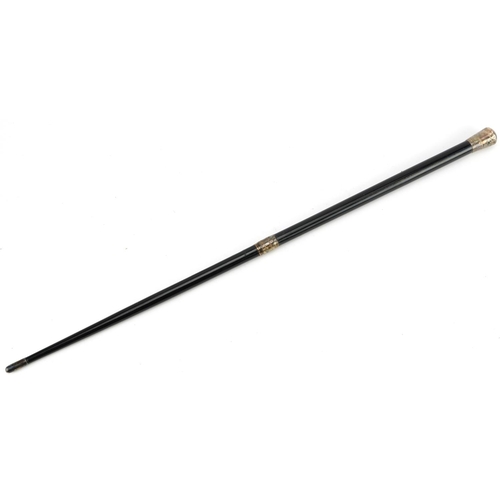 179 - Early 20th century ebonised conductor's baton with engraved silver mounts housed in a velvet and sil... 