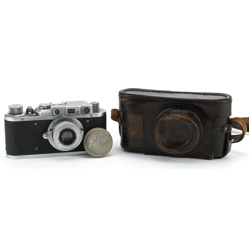 1572 - Russian Leica style camera housed in a leather case, the camera numbered 142295