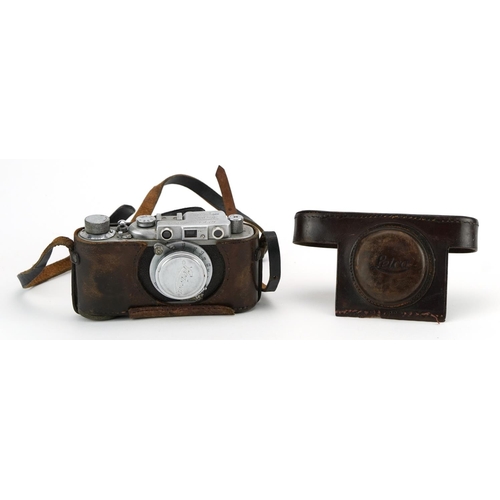 1571 - Russian Leica style camera housed in a leather case impressed Leica, the camera numbered 18573