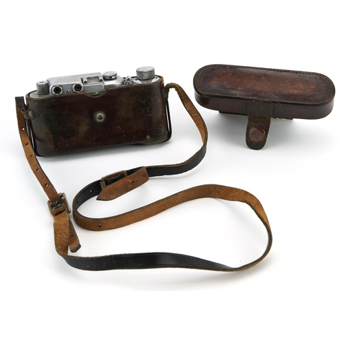 1571 - Russian Leica style camera housed in a leather case impressed Leica, the camera numbered 18573