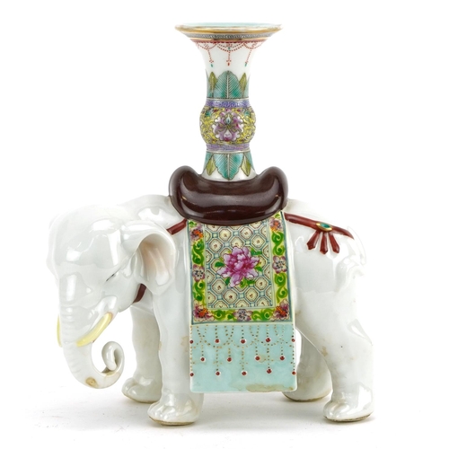 120 - Chinese porcelain candlestick in the form of an elephant, hand painted in the famille rose palette w... 