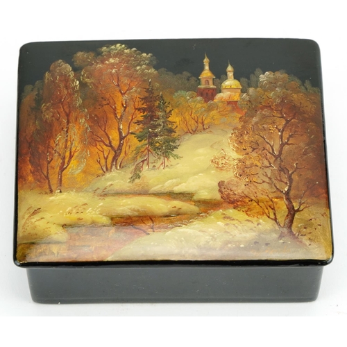 400 - Russian lacquered casket with box and hinged lid, hand painted with a snowy landscape, indistinctly ... 