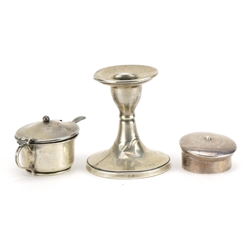 482 - Silver objects comprising circular candlestick, mustard with blue glass liner, circular pillbox and ... 