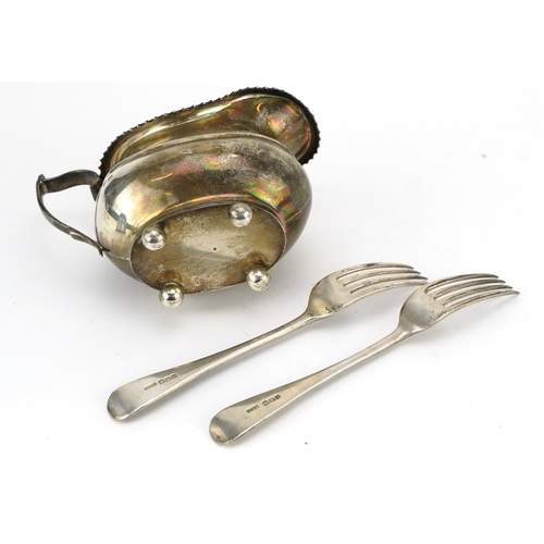 97 - George VI silver sauceboat with four ball feet and two silver forks, the sauceboat Chester 1937, the... 