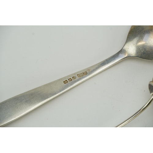 444 - Five silver spoons and a pair of silver sugar tongs, three with shell shaped bowls, the largest 19cm... 