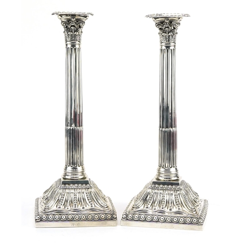 9 - William Watkins, pair of George III silver Corinthian column candlesticks, London 1766, 31cm high, 1... 