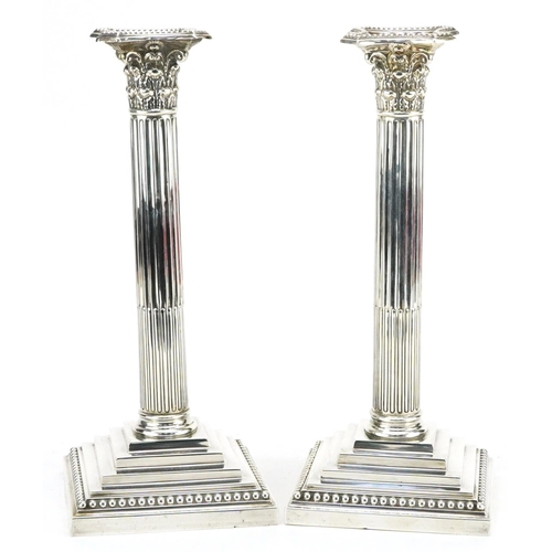 184 - William Hutton & Sons Ltd, pair of Edwardian military interest silver Corinthian column candlesticks... 