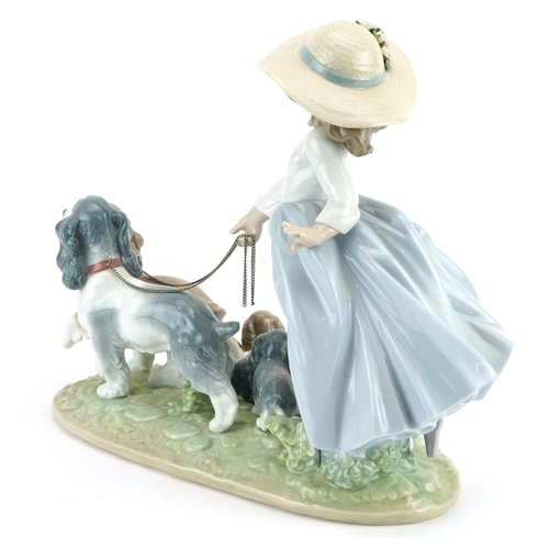 1209 - Large Lladro Privilege porcelain figure group of a young girl with dogs, 6784, 28cm in length