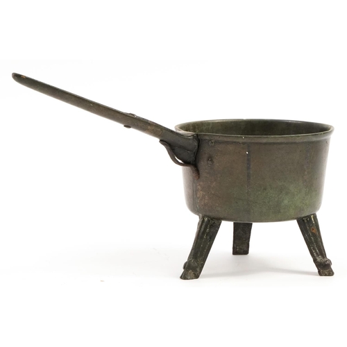 213 - Antique verdigris patinated bronze three footed skillet, 41cm in length