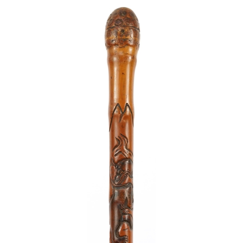 346 - Good Japanese bamboo walking stick finely carved with mythical animals and fish, signed with charact... 
