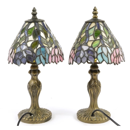 517 - Pair of bronzed Tiffany design table lamps with leaded glass floral shades, each 37.5cm high