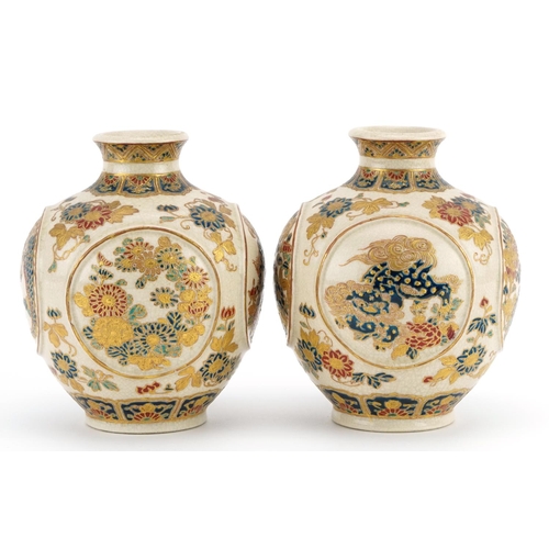 82 - Pair of Japanese Satsuma pottery vases finely gilded with panels of dragons and flowers, character m... 