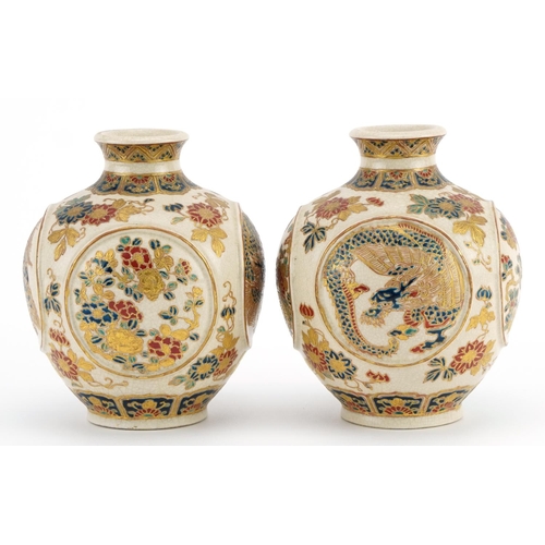 82 - Pair of Japanese Satsuma pottery vases finely gilded with panels of dragons and flowers, character m... 