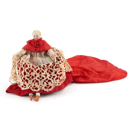 2011 - 19th century French bisque porcelain doll of a boy wearing a Cardinal's robe, the doll 22.5cm high