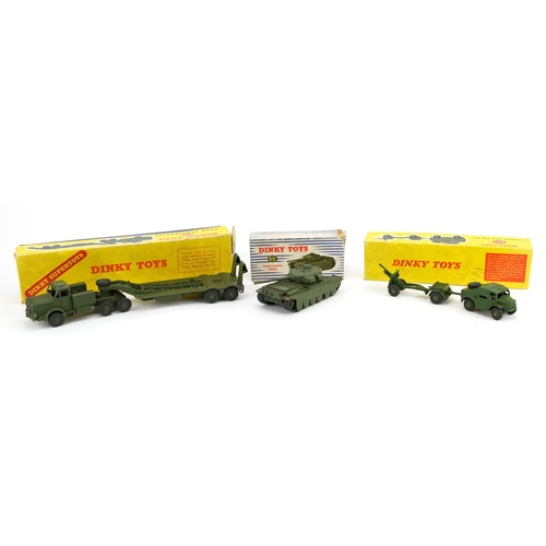 2024 - Three vintage Dinky Toys diecast army vehicles with boxes comprising Tank Transporter 660, 25-Pounde... 