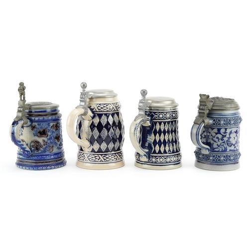 526 - Four German salt glazed steins with pewter hinged lids, 18cm high